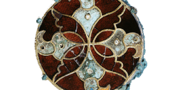 Brooch made of garnet and other gemstones, featuring a bird-of-prey design